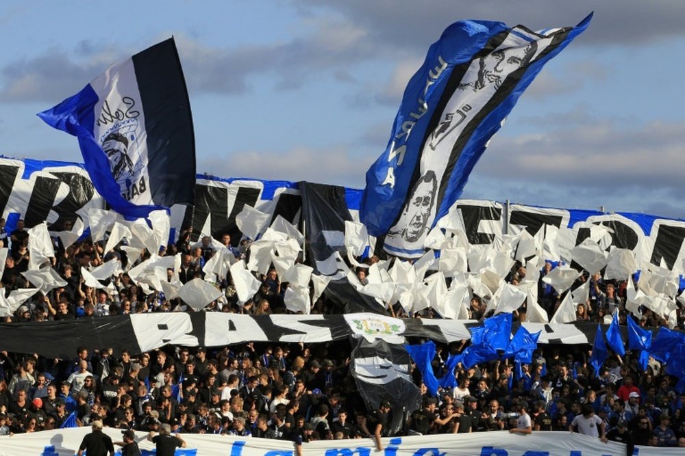 Bastias supporters cheer their team before a L1 football match against Paris on October 17, 2015, at the Armand Cesari stadium in Bastia