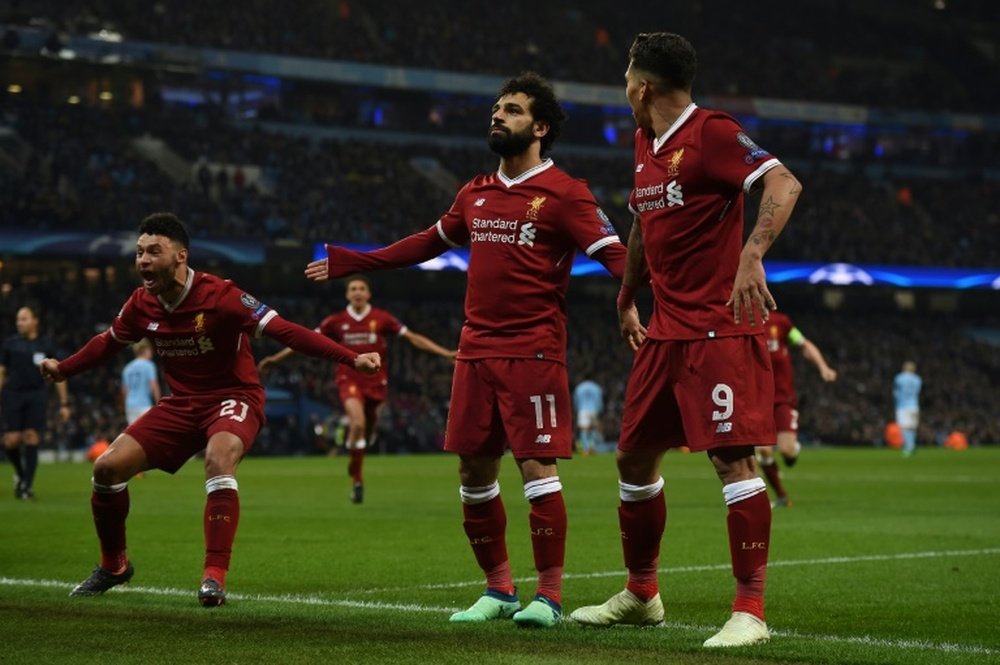 Liverpool won 1-2 through goals from Firmino and Salah. AFP