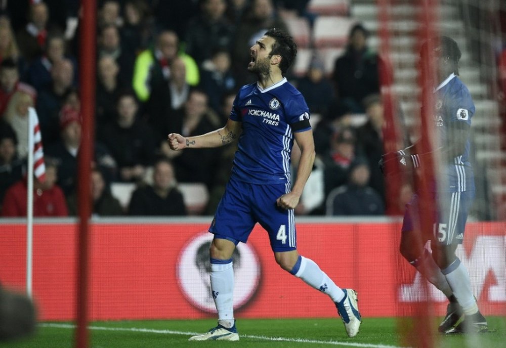 Chelseas Spanish midfielder Cesc Fabregas celebrates scoring his teams first goal during the English Premier League football match between Sunderland and Chelsea at the Stadium of Light in Sunderland, north-east England on December 14, 2016
