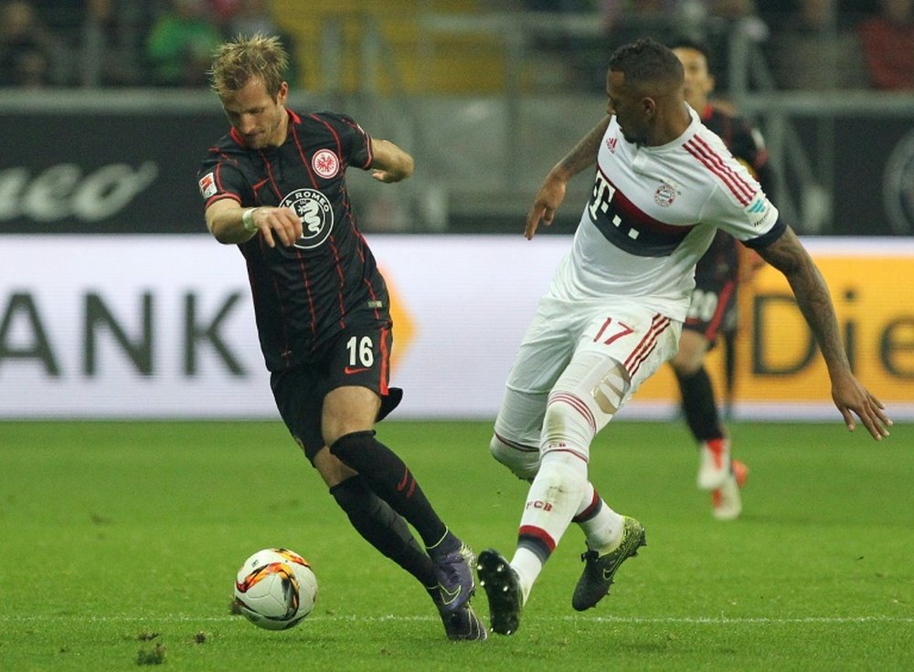 Frankfurts midfielder Stefan Aigner (L) and Bayern Munichs defender Jerome Boateng vie for the ball during the German first division Bundesliga football match in Frankfurt am Main, western Germany, on October 30, 2015