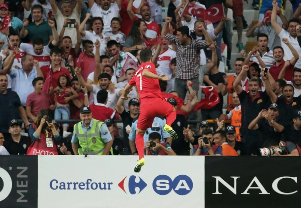 Turkeys midfielder Oguzhan Ozyakup celebrates after scoring a goal against Netherlands during a Euro 2016 qualifying match at the Arena Stadium in Konya, on September 6, 2015 in Konya