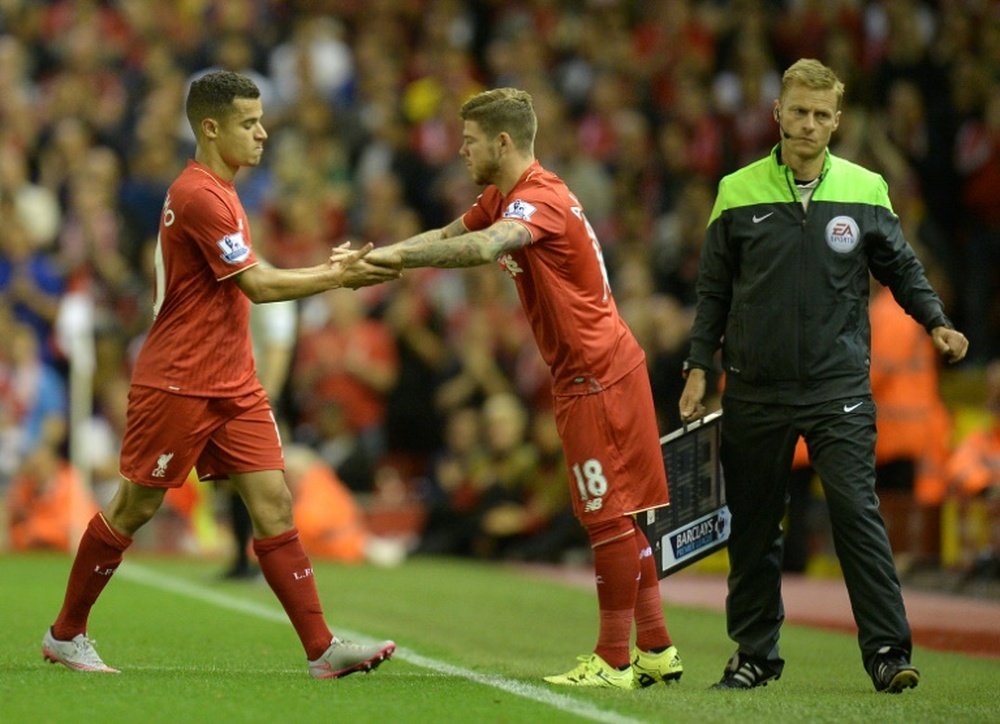 Philippe Coutinho (left) is substituted by Alberto Moreno during Liverpools Premier League game against Bournemouth at Anfield on August 17, 2015