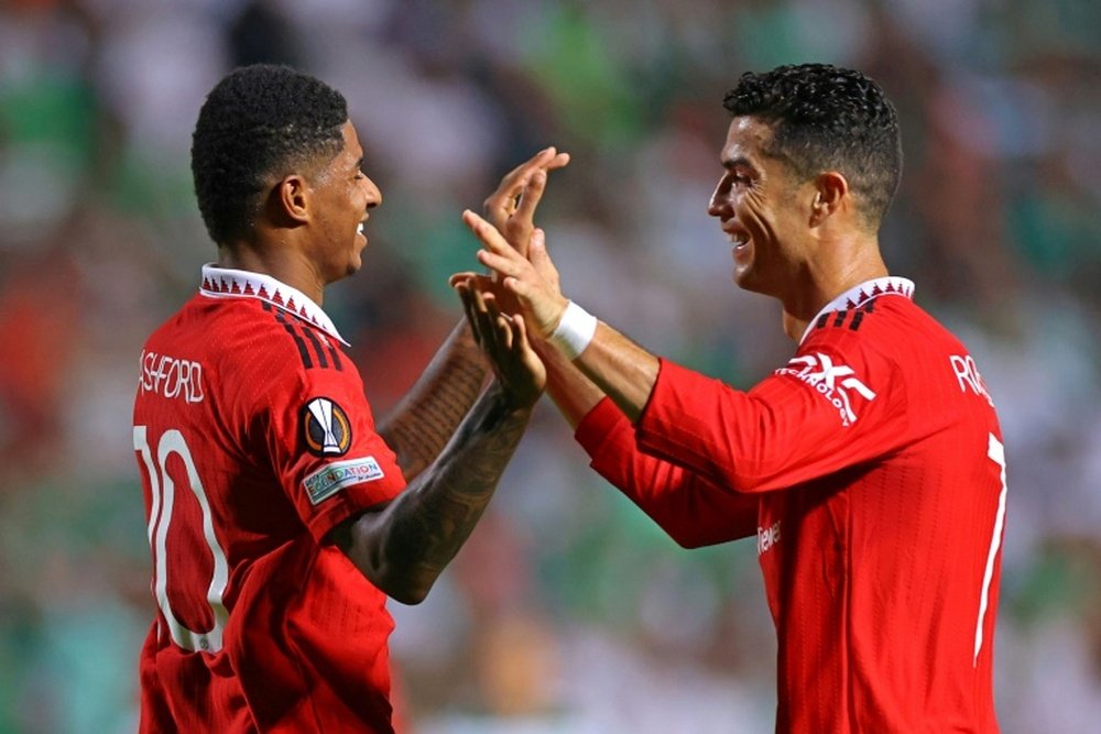 Rashford (L) has scored 30 goals this season. AFP