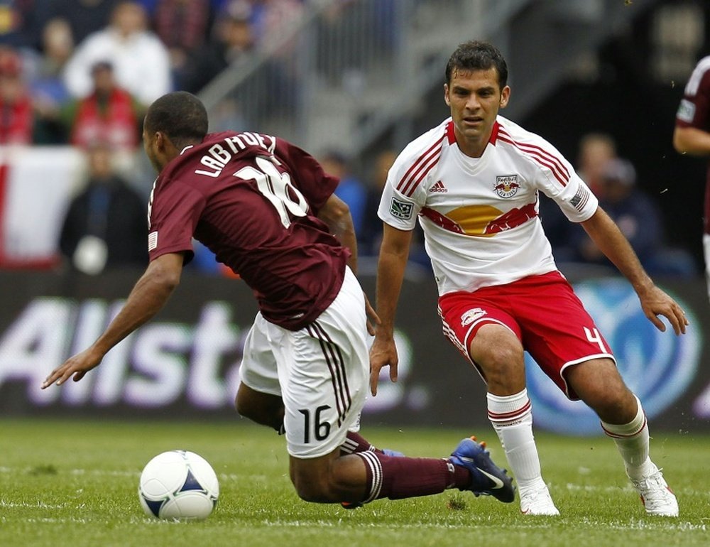 Rafa Marquez #4 of the New York Red Bulls trips up Ross Labauex #16 of the Colorado Rapids during their game at Red Bull Arena on March 25, 2012 in Harrison, New Jersey
