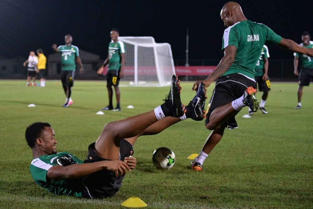 Ghana's Jordan Ayew and Andre Ayew (R) take part in a team training session in Port-Gentil on January 15, 2017, during the 2017 Africa Cup of Nations tournament in Gabon