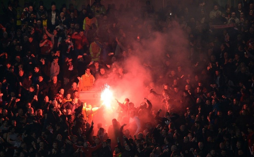 Basel fans lit flares like the one pictured here. AFP