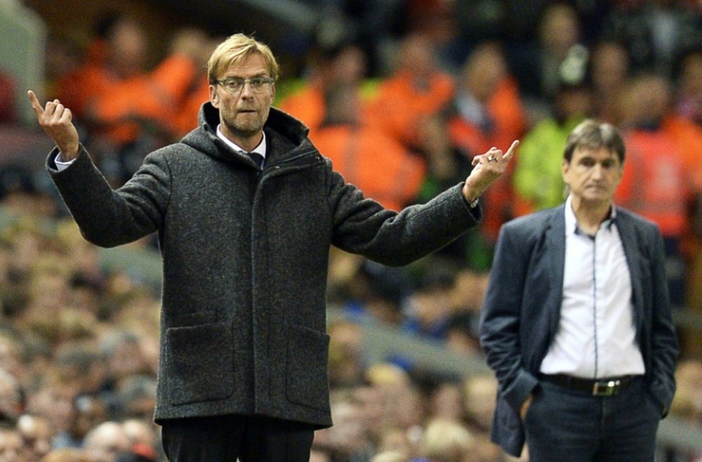 Liverpools manager Jurgen Klopp (L) gestures next to Rubin Kazans counterpart Valeri Chaly during their UEFA Europa League Group B match, at Anfield in Liverpool, on October 22, 2015