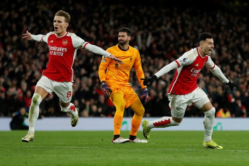 Arsenal are two points behind leaders Liverpool after 23 games each. AFP