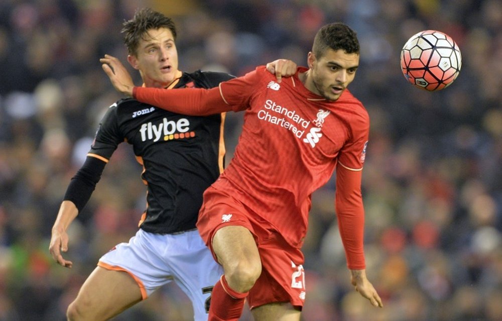 Exeter City striker Tom Nichols (L) vies with Liverpool defender Tiago Ilori during the FA Cup third round replay match between Liverpool and Exeter City on January 20, 2016, which Liverpool won 3-0