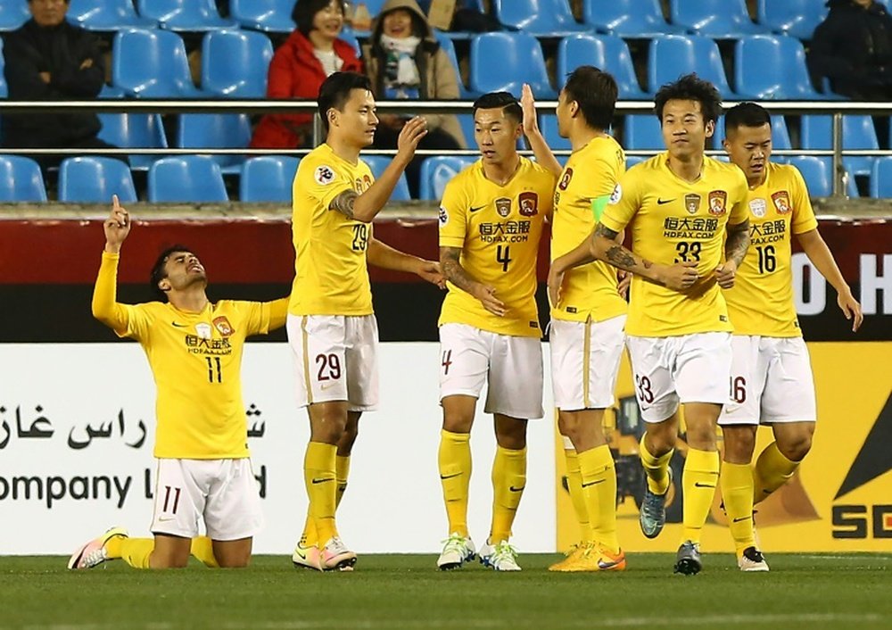 Guangzhou Evergrande players celebrate after scoring a goal in an AFC Champions League match. AFP
