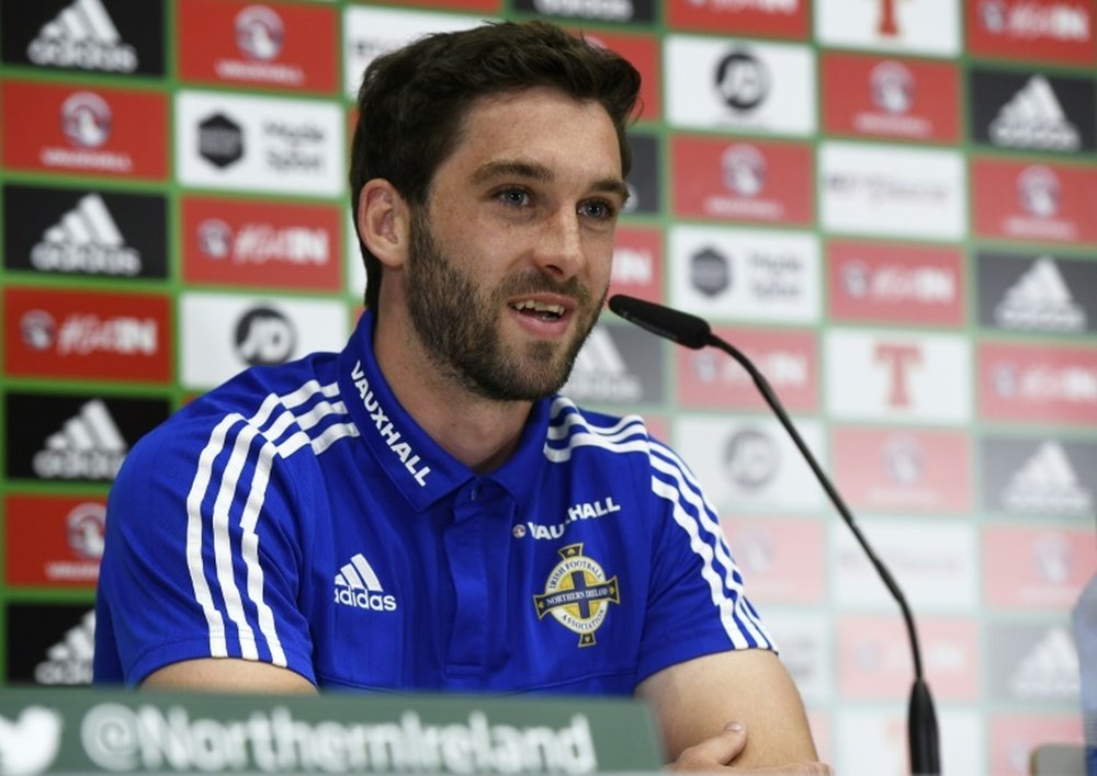 Striker Will Grigg has become a cult hero with Northern Ireland fans. AFP