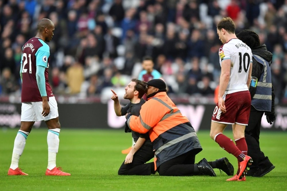 Pitch invasions made for an unpleasant atmosphere at London Stadium. AFP