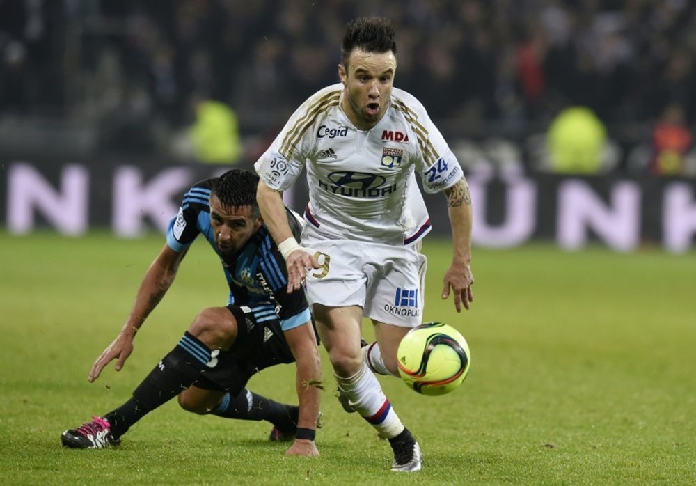 Mathieu Valbuena (upright) plays for Lyon against Marseille on January 24, 2016, at the Parc Olympique Lyonnais stadium in Decines-Charpieu, France