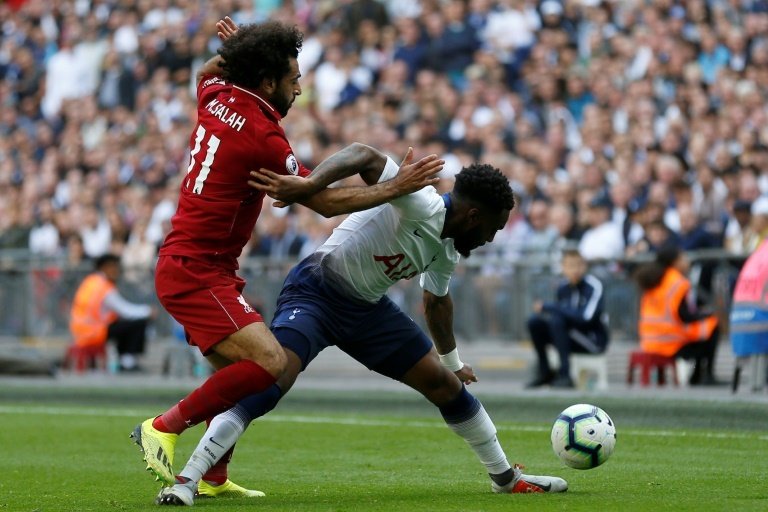 Rose battles Mo Salah. AFP