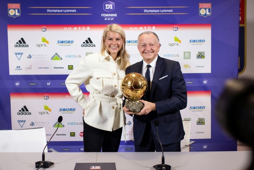 Jean-Michel Aulas with Ada Hegerberg and the Balon D'Or. AFP