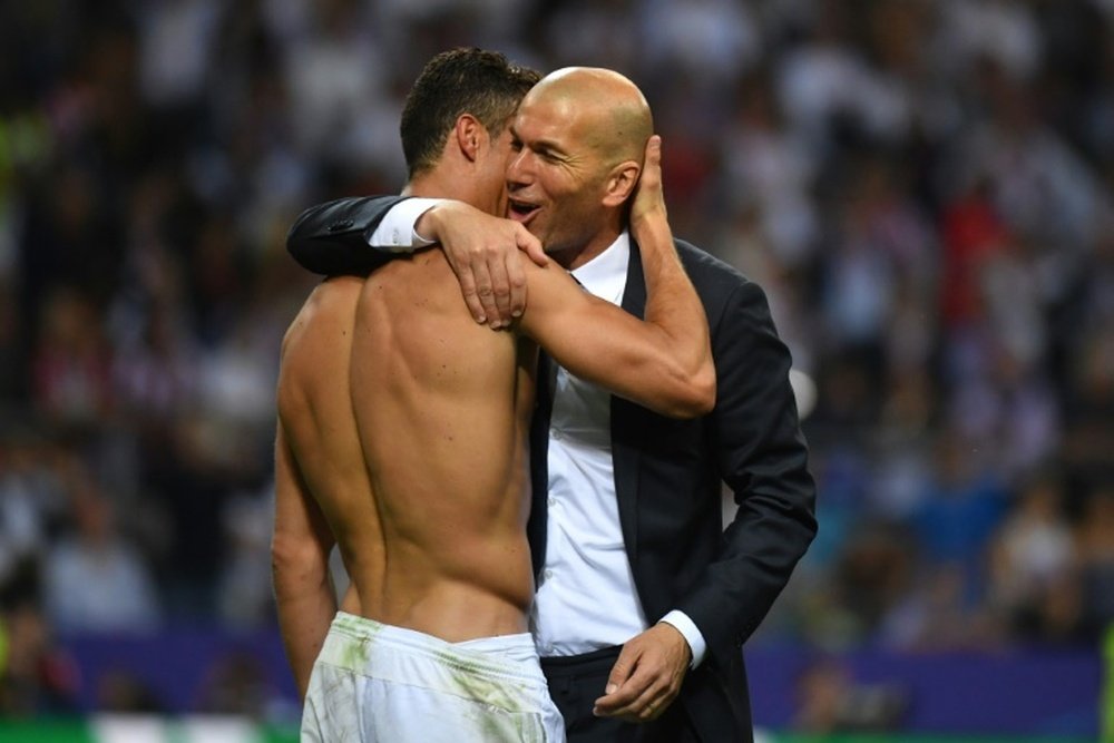 Ronaldo and Zidane embrace after winning the Champions League in May. AFP