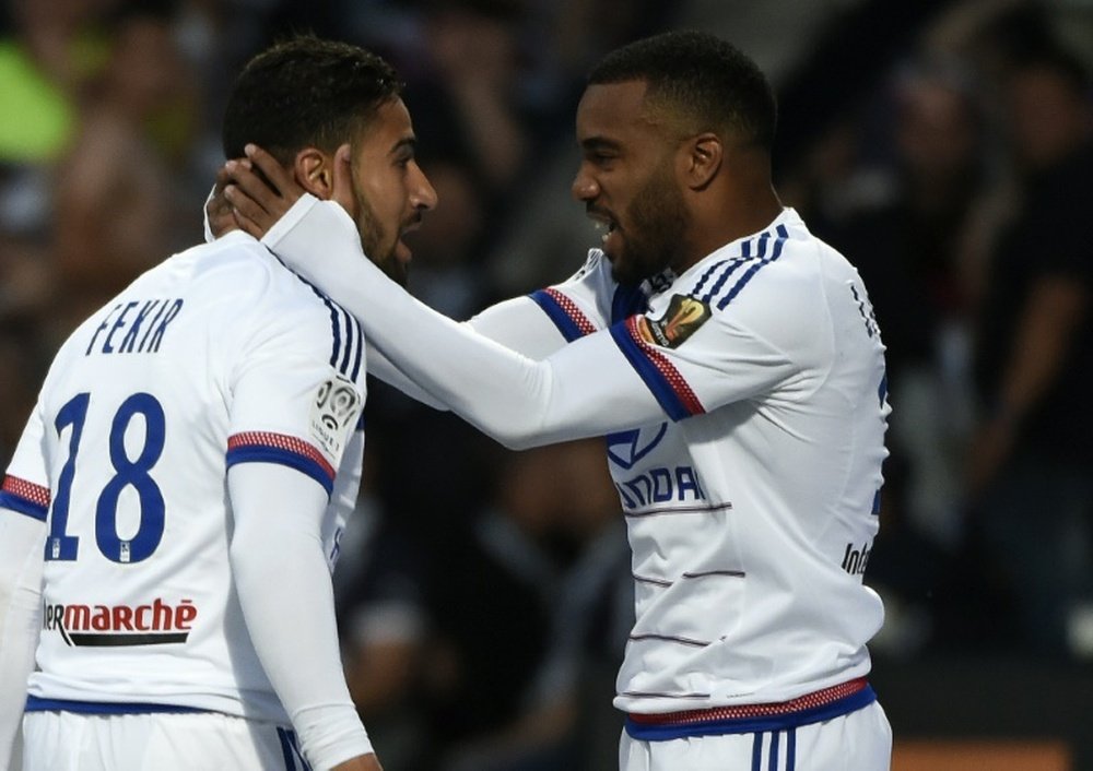 The Lyon attackers Nabil Fekir and Alexandre Lacazette celebrating a goal. AFP