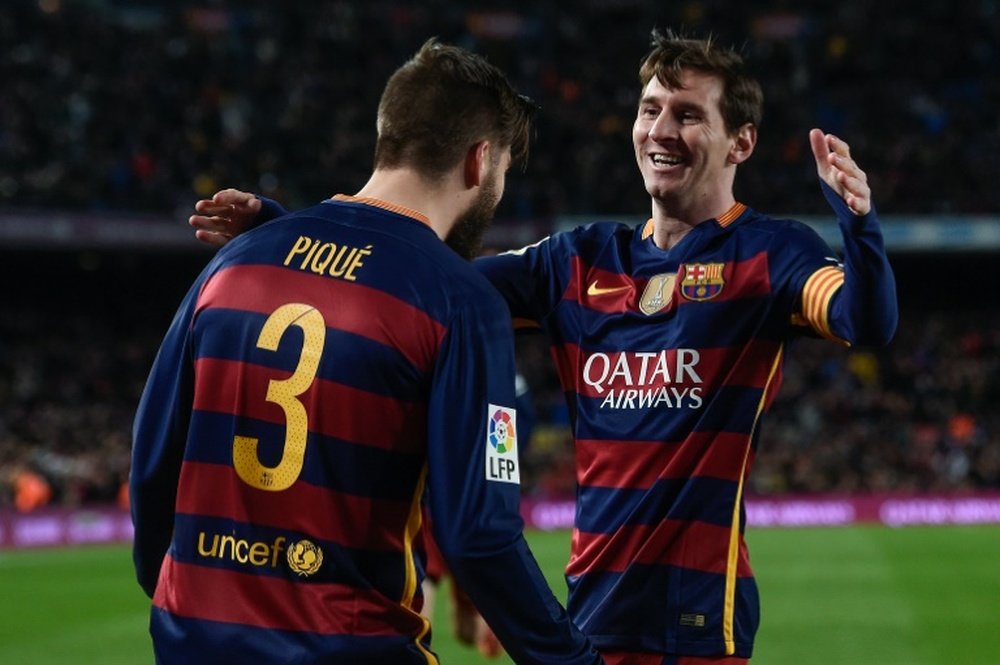 Les buteurs du FC Barcelone face à Séville Gérard Piqué et Lionel Messi, le 28 février 2016. AFP