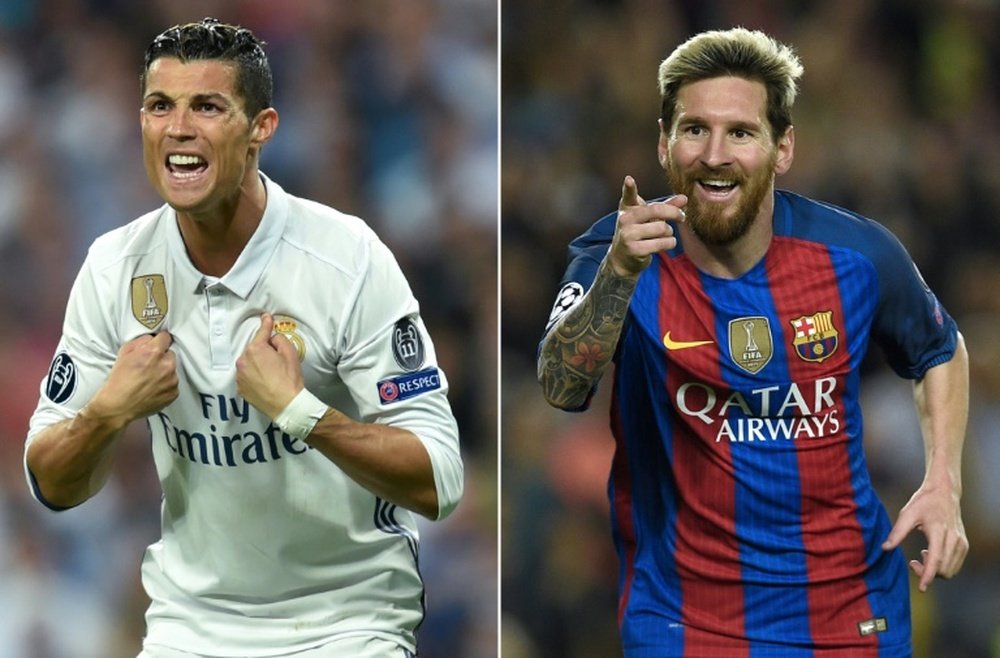 Ronaldo feels he deserves a more lucrative contract than Messi. AFP