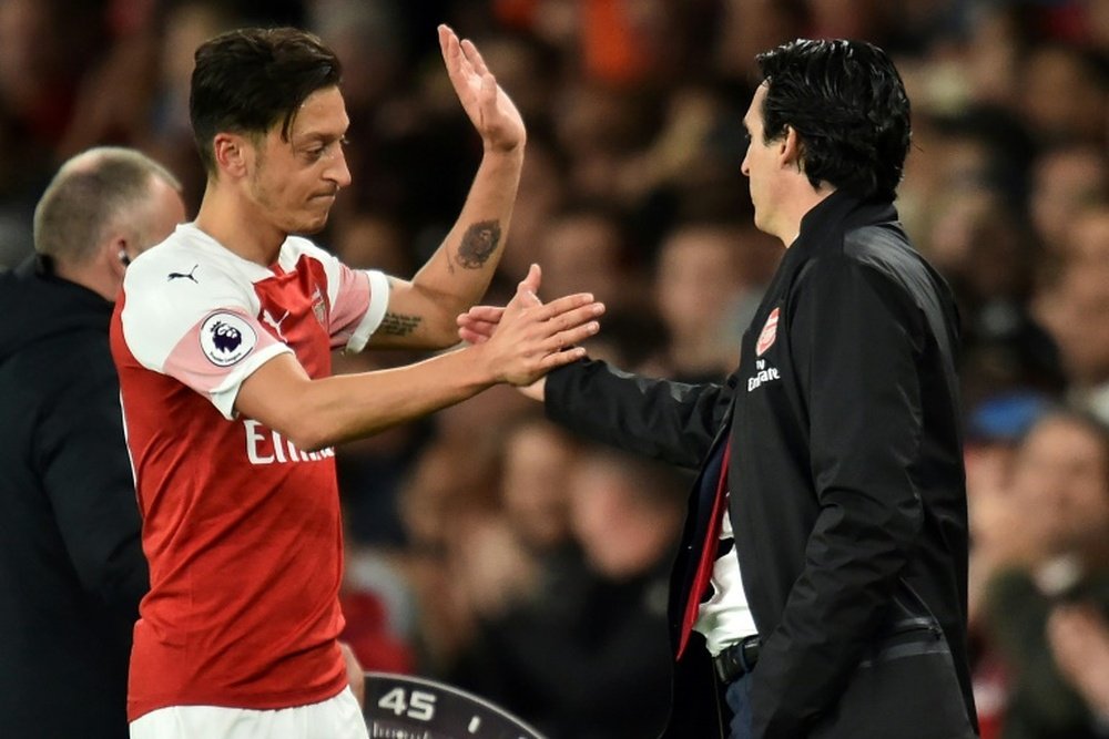 Ozil has had a topsy turvy few months at the Emirates. AFP