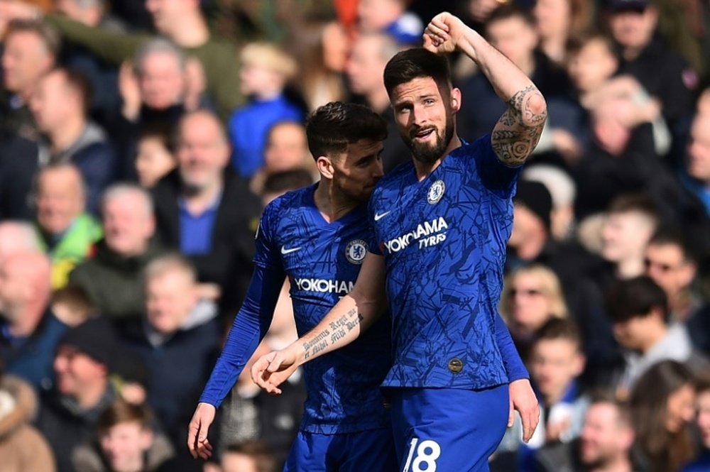 Olivier Giroud (R) looks set to stay at Chelsea. AFP