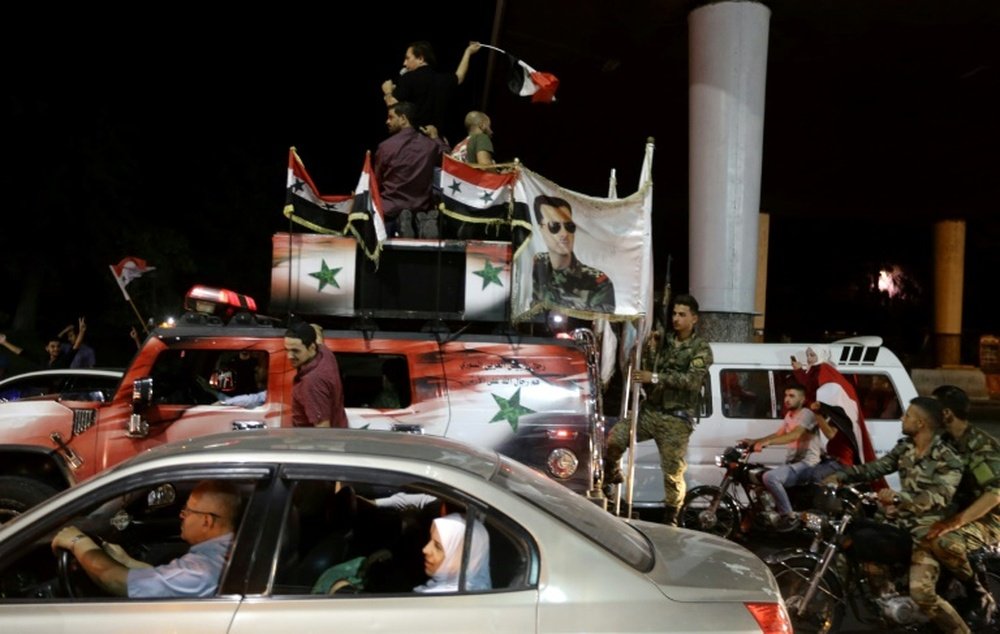 Les supporters syriens fêtant le match nul de leur équipe contre l'Iran à Téhéran. AFP