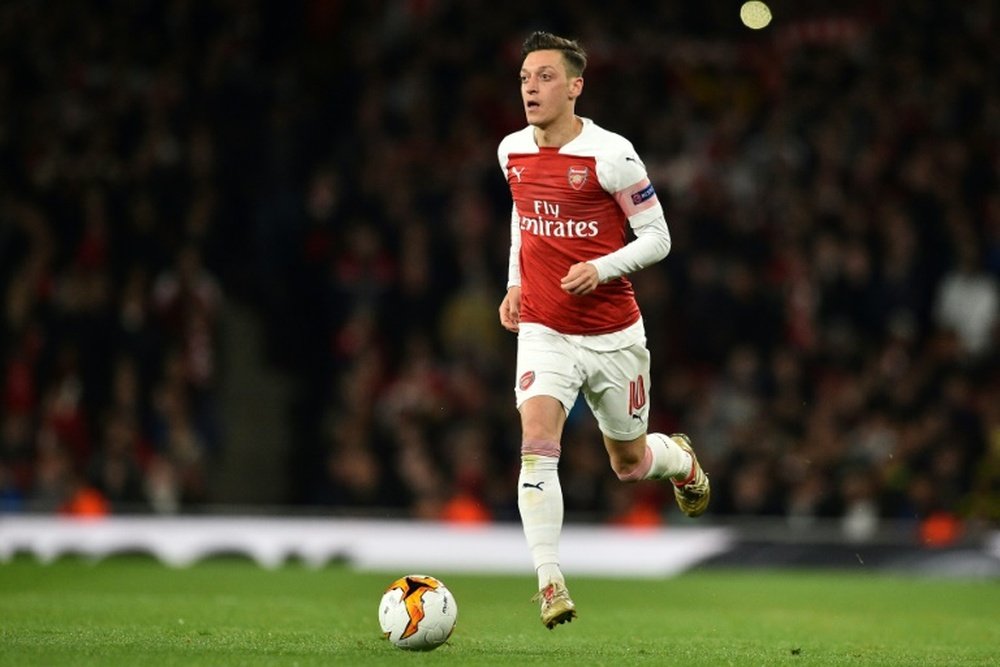 Mesut Ozil is staying at Arsenal. AFP