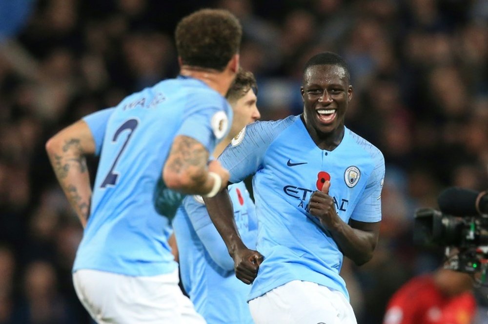 Benjamin Mendy says City are not ready to give up just yet. AFP