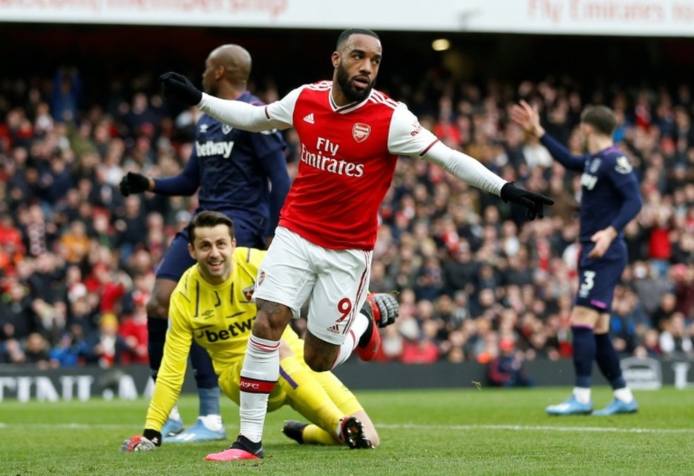 Arsenal will take money off players if they do not make Champions League. AFP