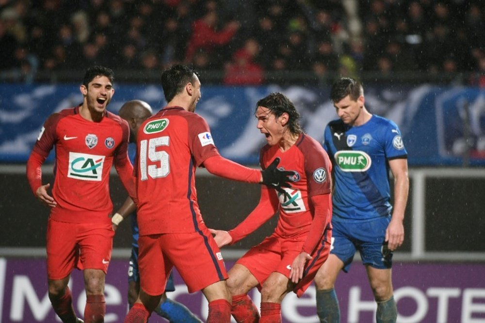 Cavani celebrates his extra-time goal which eases PSG through to next round.