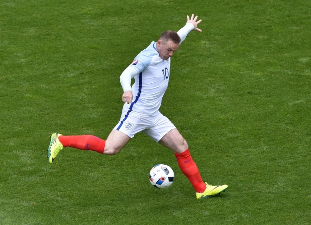 Carragher backs Rooney retirement. AFP