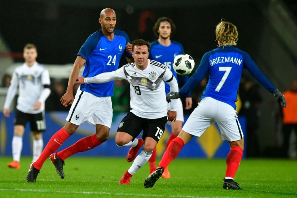 Gotze vies with Steven Nzonzi and Antione Griezman. AFP