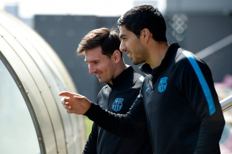 Suarez supports his team-mate. AFP