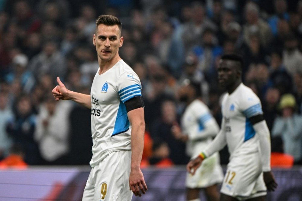 Milik to join Juve on loan for two million. AFP