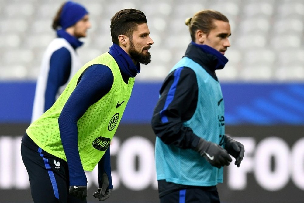 Giroud could become Griezmann's team-mate at club level. AFP