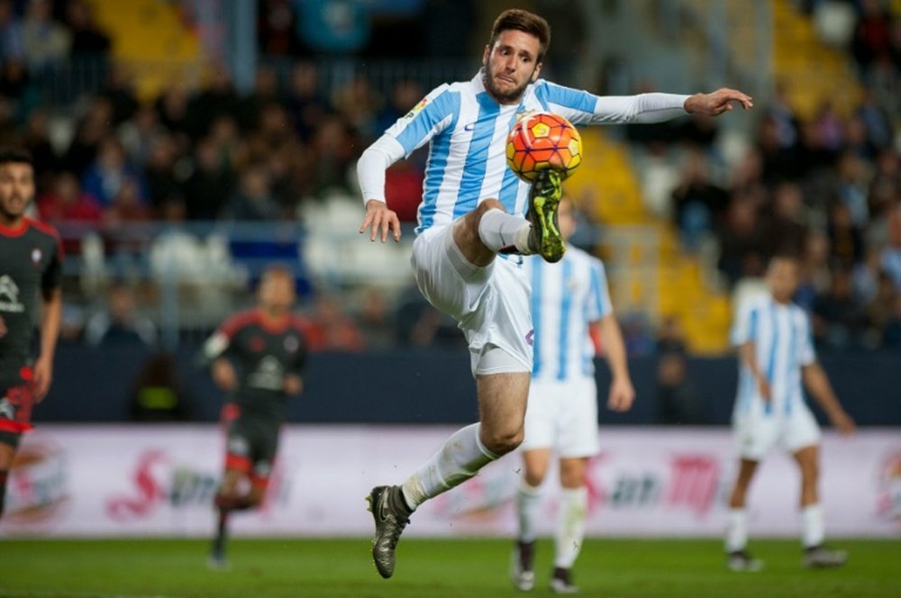 L'attaquant croate de Malaga Duje Cop contre le Celta Vigo au stade de La Rosaleda. AFP