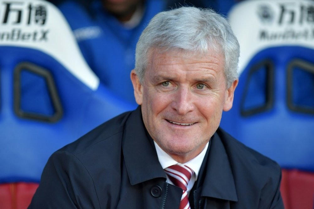 Hughes has eight games to keep Southampton in the Premier League. AFP