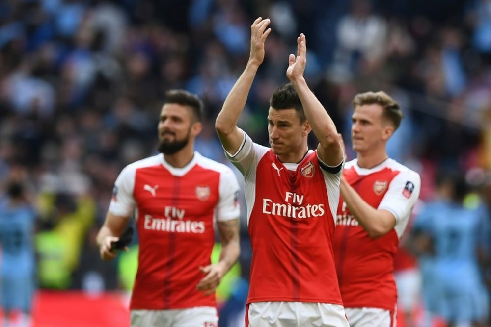 Arsenal maintain hope of qualifying for the Champions League. AFP