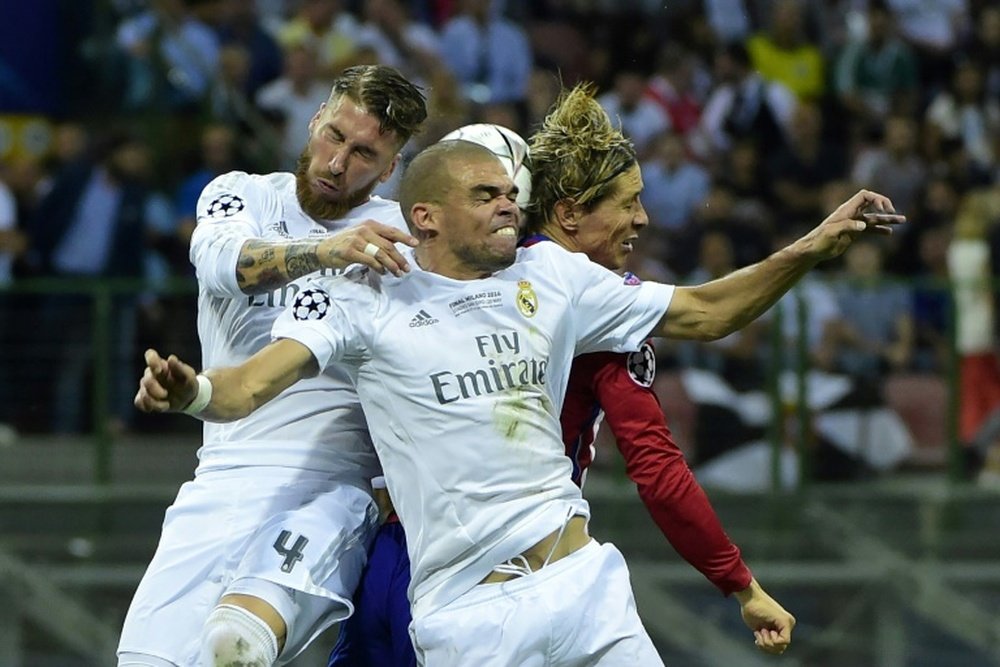 Sergio Ramost and Pepe heading the ball. AFP