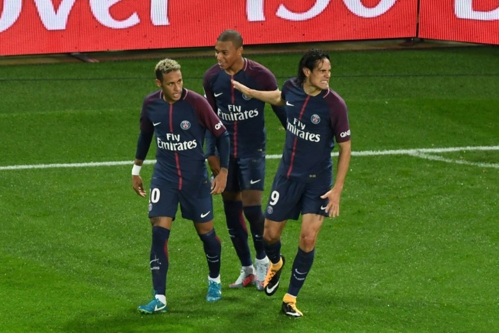 PSG's front three celebrate during their 2-0 win over Lyon. AFP