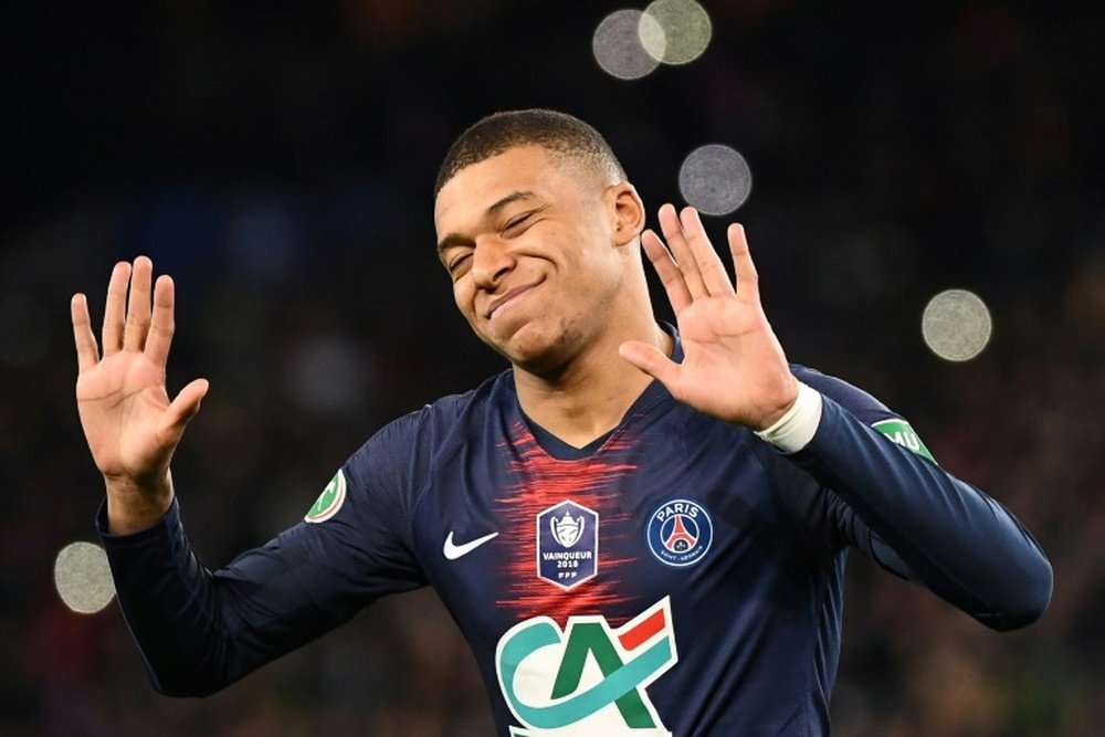 Mbappe says he is not as good as Messi and Ronaldo. AFP
