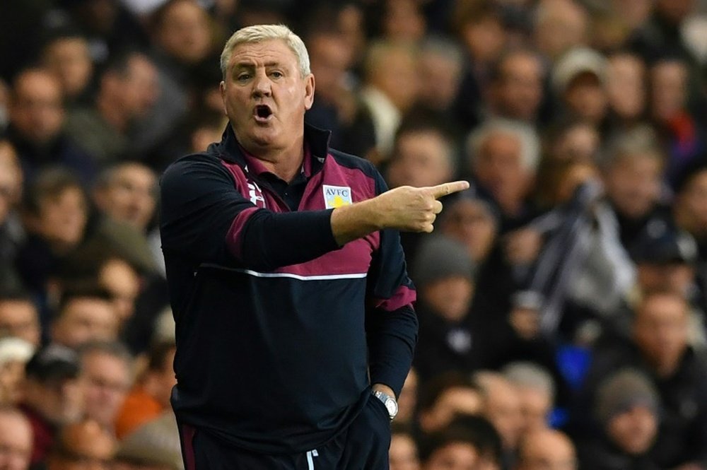 Bruce is unphased by the economic certainty at Aston Villa. AFP