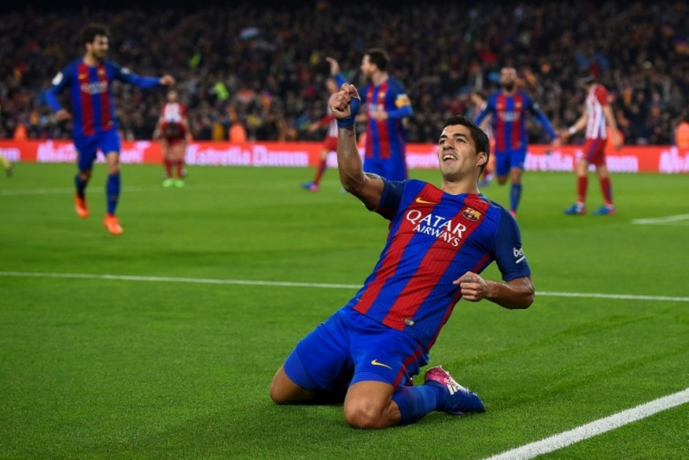 L'attaquant du Barça Luis Suarez en liesse après avoir inscrit un but contre l'Atletico Madrid. AFP