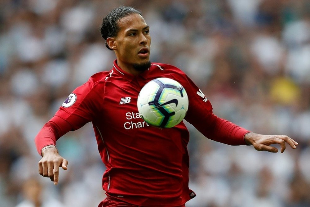 Virgil van Dijk is reportedly playing for Liverpool with broken ribs. AFP