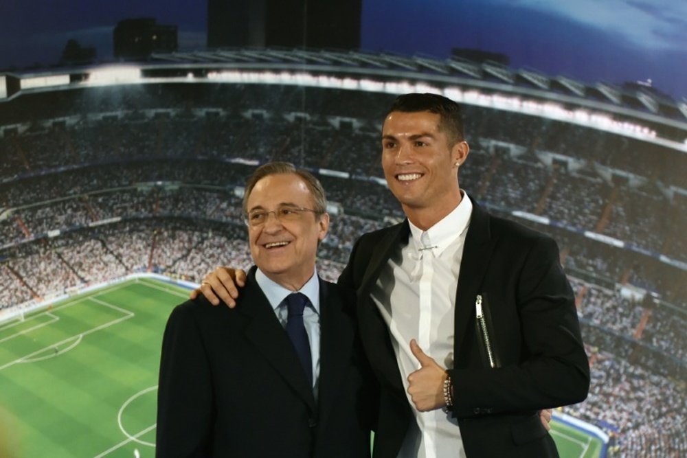 Cristiano Ronaldo and Florentino Perez posing together for a picture. AFP