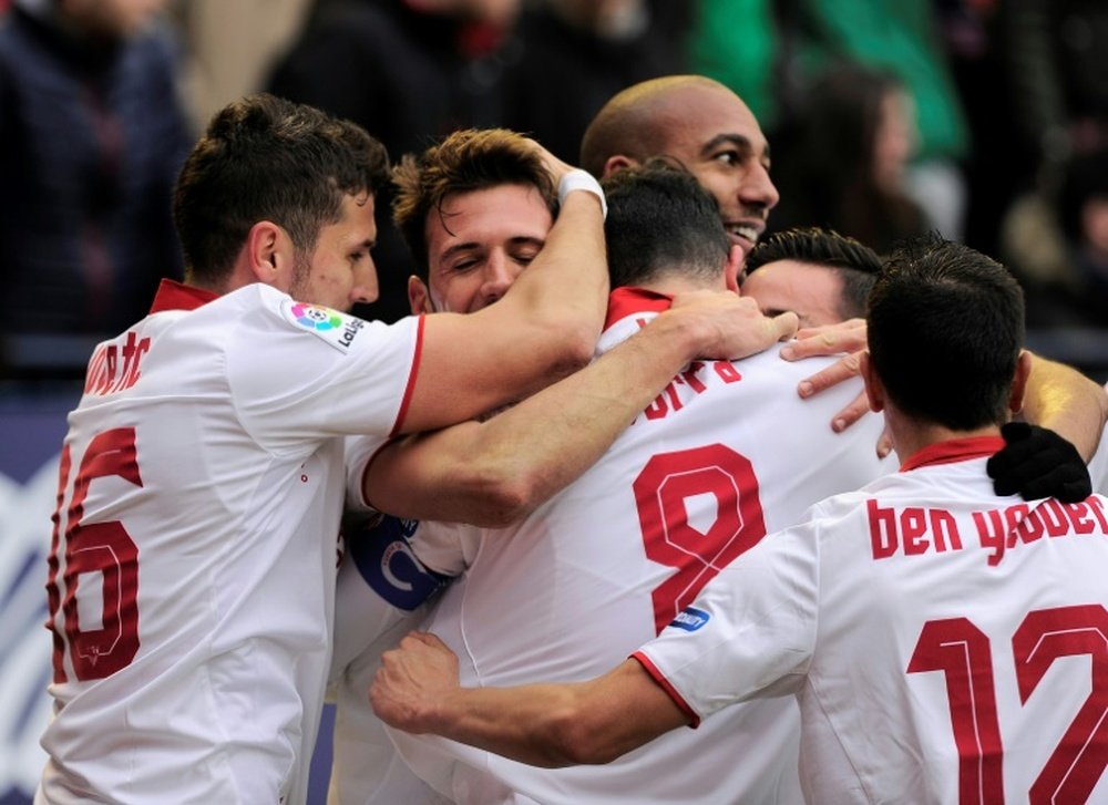 Sevilla players celebrating a goal. AFP