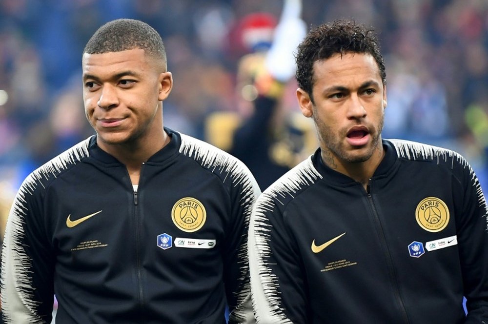 Mbappe wants more responsability in PSG, but not through Neymar's exit. AFP