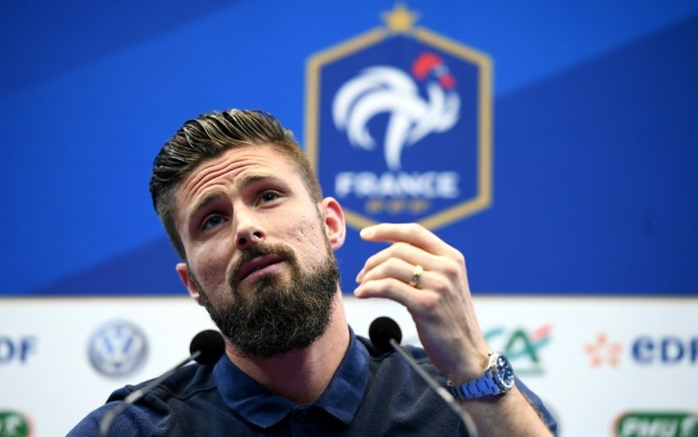 French Forward Olivier Giroud being quizzed by the press.