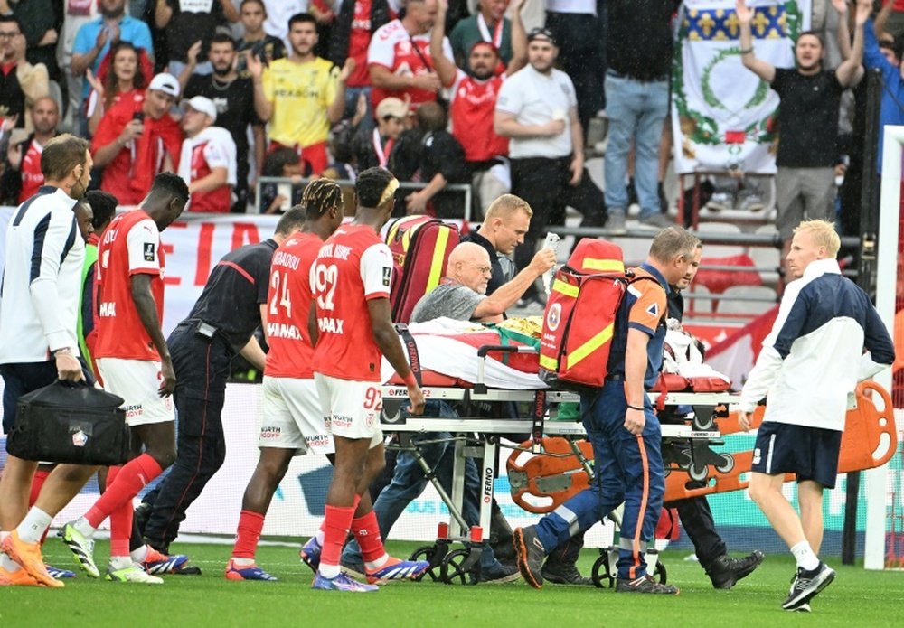 Gomes was left motionless lying on his back after a collision with Kone. AFP