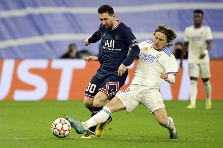 Luka Modric y Leo Messi en un partido de Champions